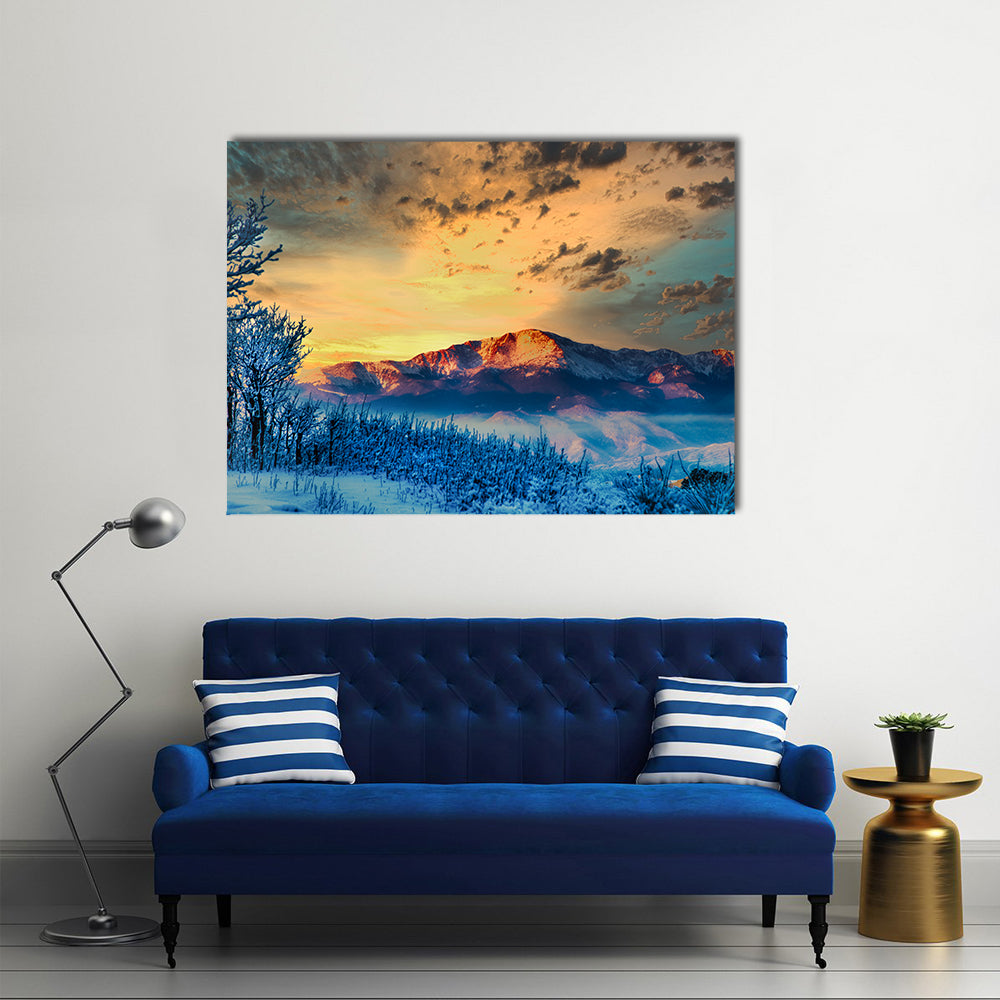 Pikes Peak at Dawn Canvas Wall Art in orange, yellow and blue, single panel hung on a wall