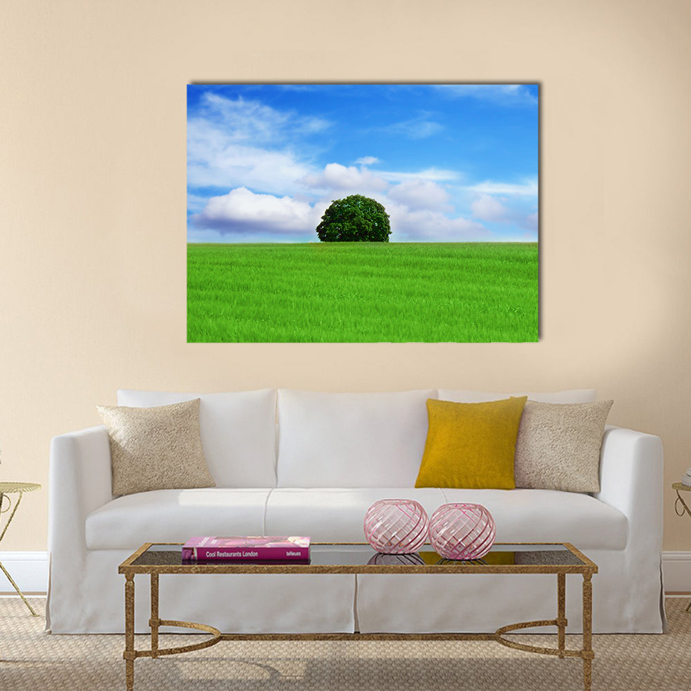 Lone Tree in Vibrant Green Field Canvas Wall Art in white, green and blue, single panel hung on a wall