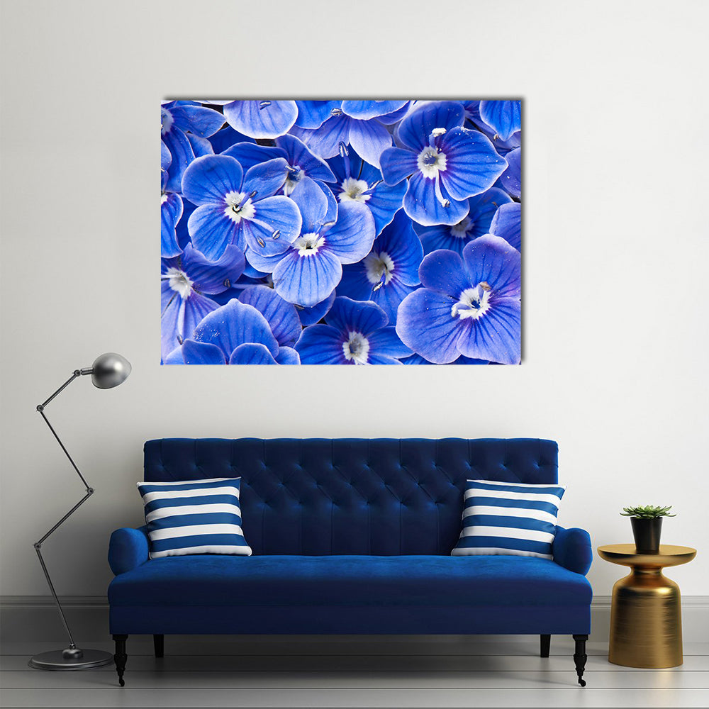 Blue Flowers Canvas Wall Art in white and blue, single panel hung on a wall