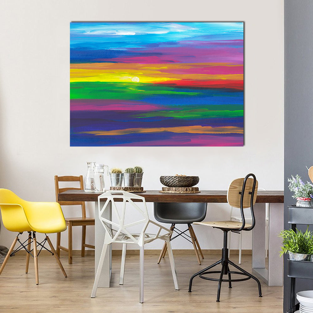 Abstract Sunset Landscape with Impasto Sun Canvas Wall Art in yellow, blue and multicolor, single panel hung on a wall