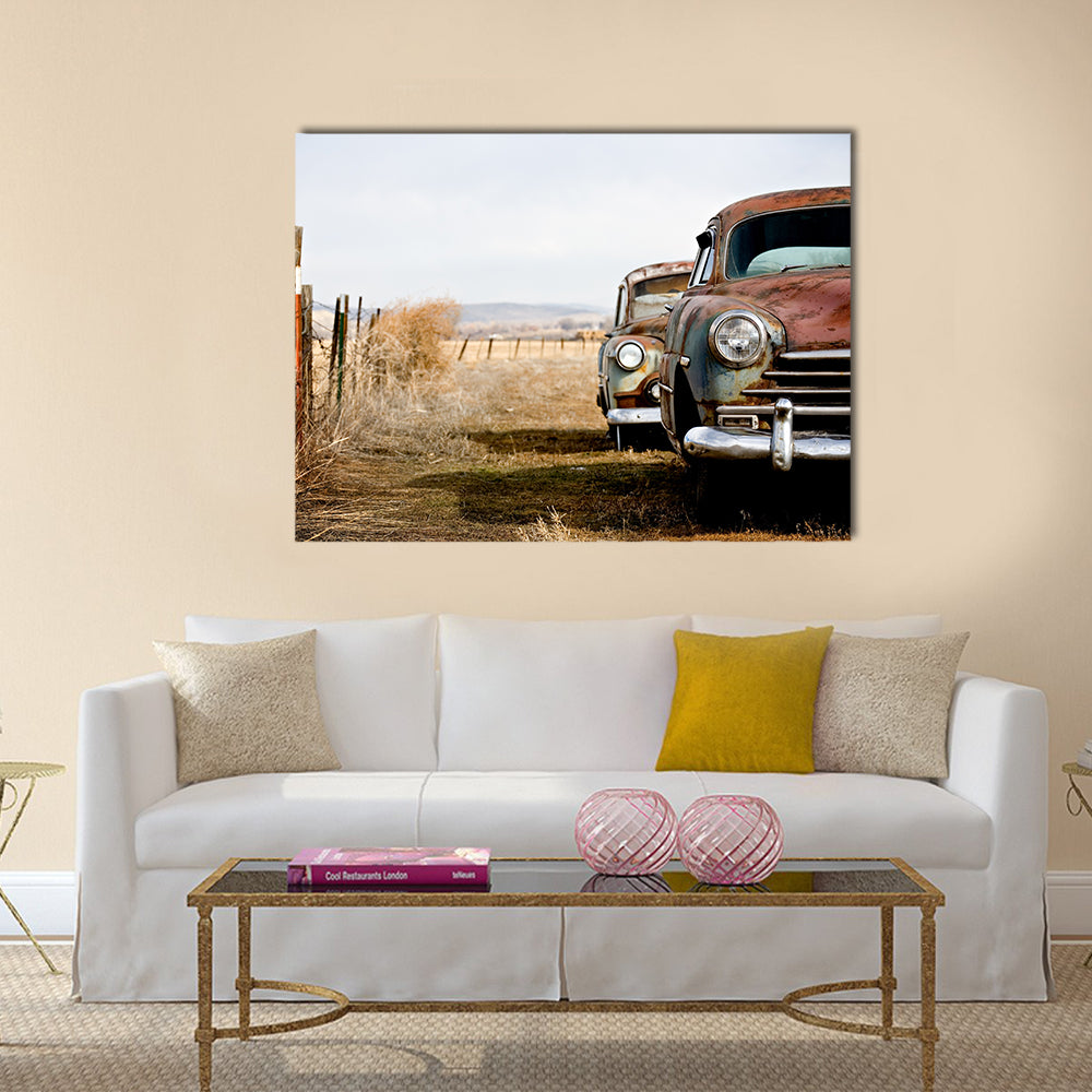Rusty Vintage Cars in Rural Field Canvas Wall Art in white, beige and brown, single panel hung on a wall