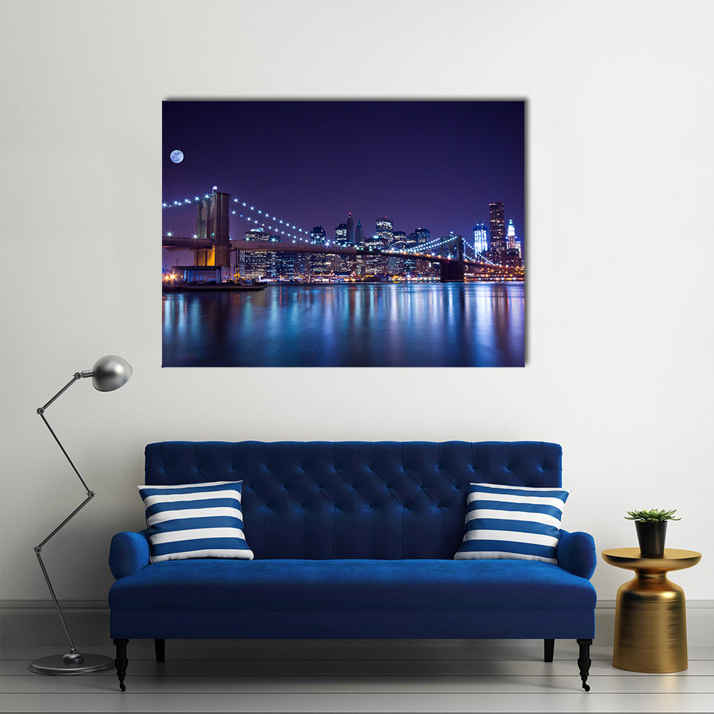 Brooklyn Bridge at Night Canvas Wall Art in black, blue and purple, single panel hung on a wall