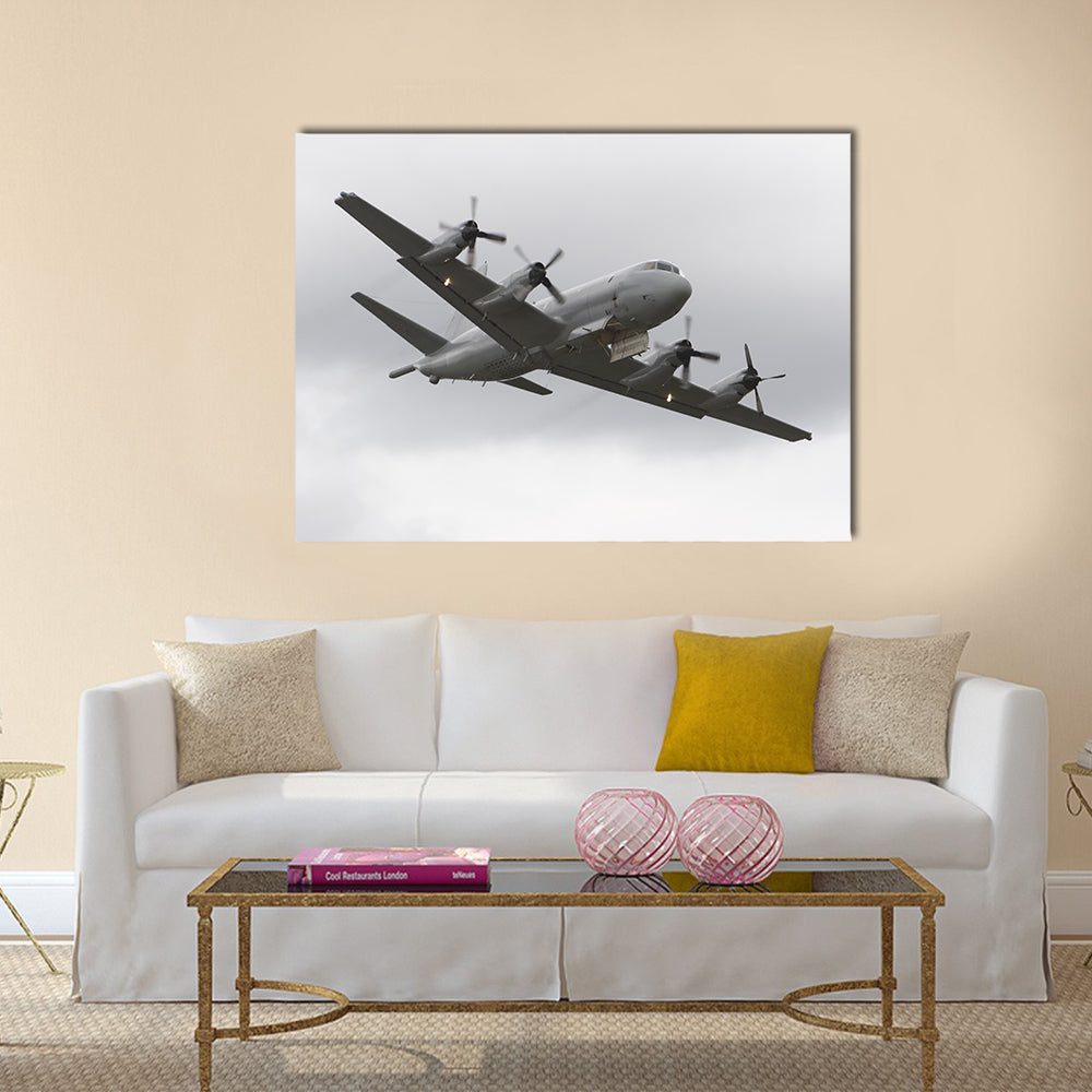 Four-engine Military Surveillance Plane Canvas Wall Art in white and gray, single panel hung on a wall
