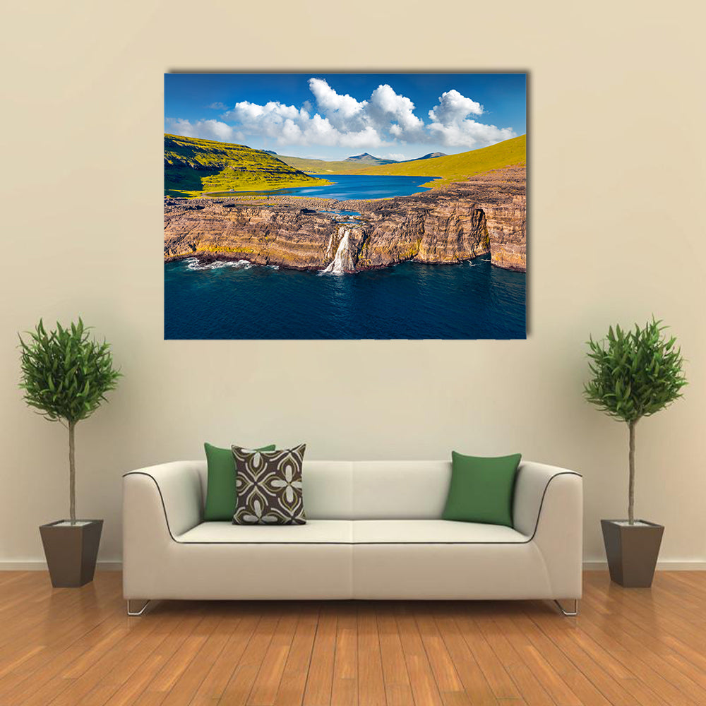 Bosdalafossur Waterfall And Sorvagsvatn Lake In Denmark Canvas Wall Art in brown, green and blue, single panel hung on a wall