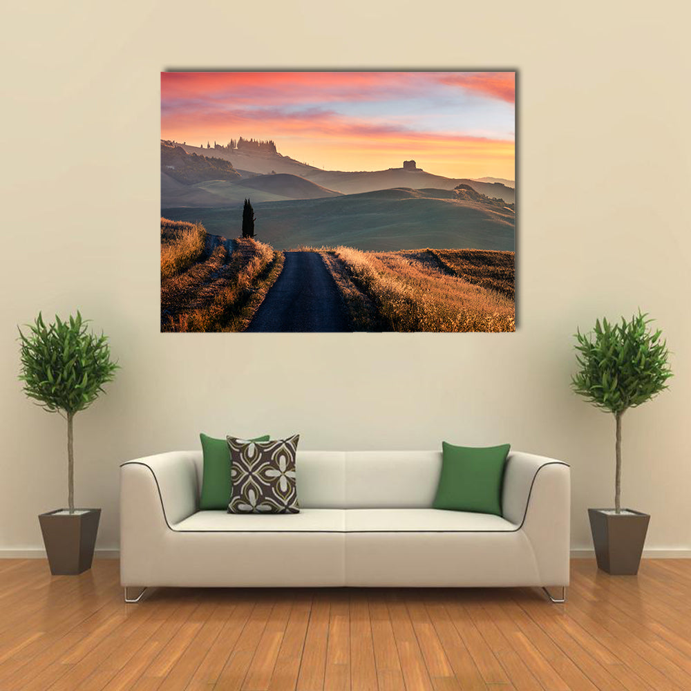 Sunrise Of Italian Countryside Canvas Wall Art in brown, orange and yellow, single panel hung on a wall