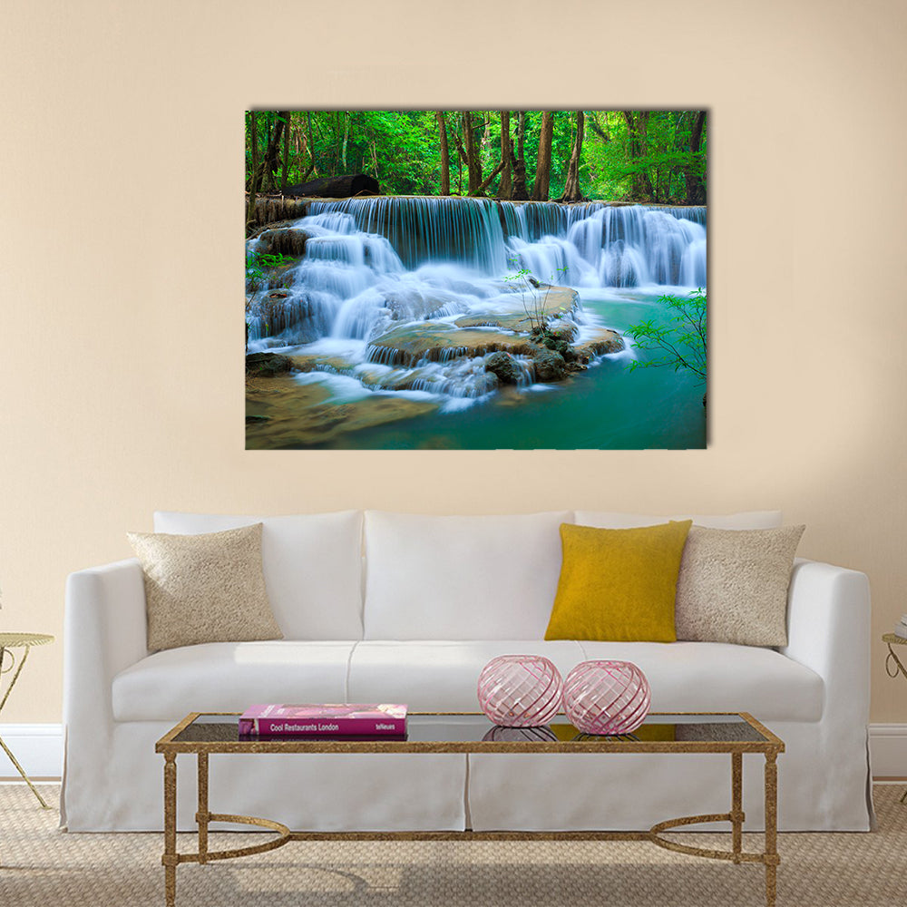 Huay Ma Khamin Waterfall In Kanchanaburi Thailand Canvas Wall Art in white, green and blue, single panel hung on a wall