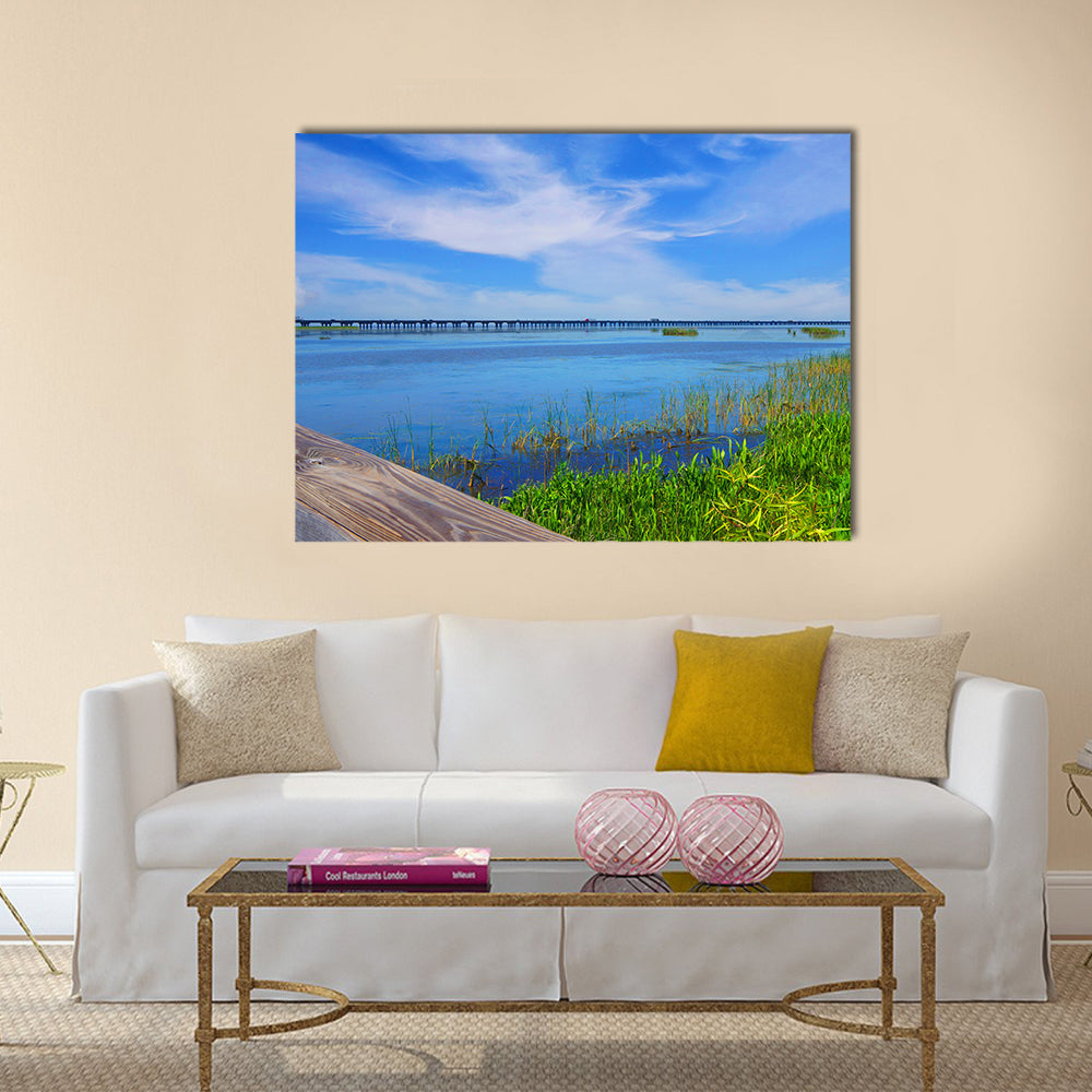 Meaher State Park Causeway Bridge Over Mobile Bay Canvas Wall Art in white, green and blue, single panel hung on a wall