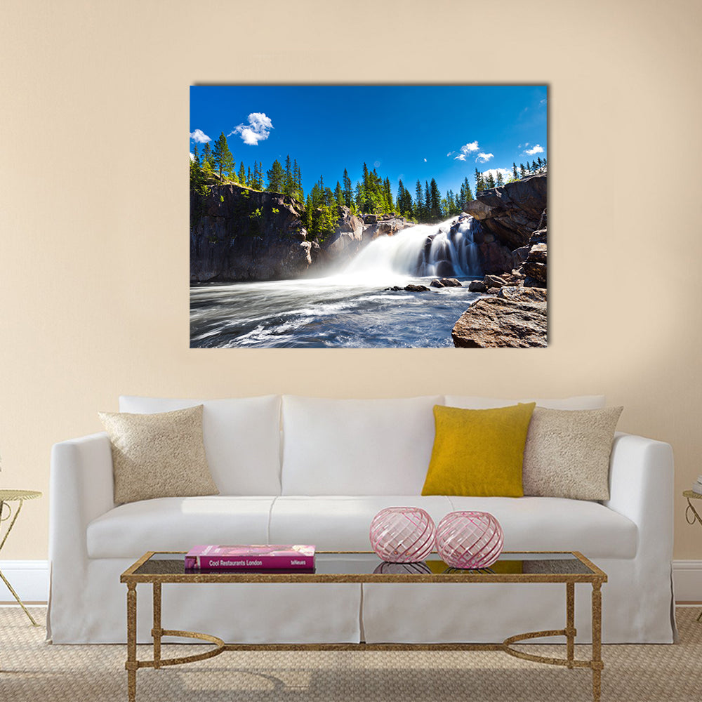Scenic Waterfall Canvas Wall Art in white, green and blue, single panel hung on a wall