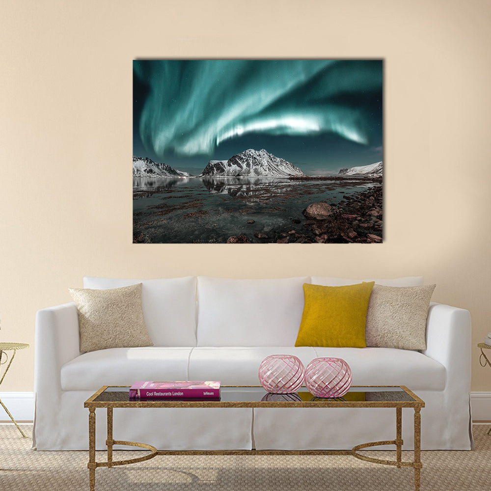 Northern Lights Over Lofoten Canvas Wall Art in black, green and blue, single panel hung on a wall