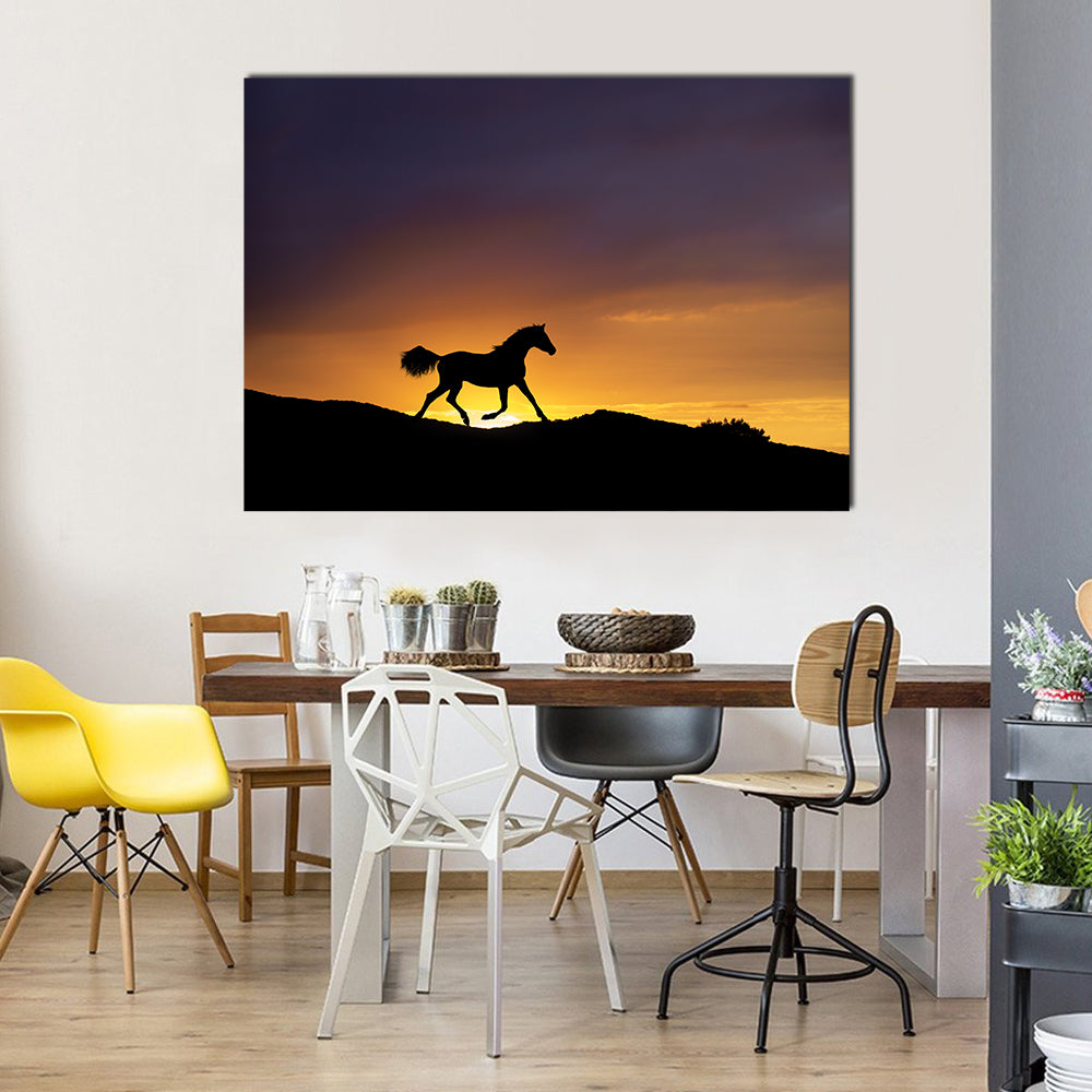 Galloping Horse Silhouette at Sunset Canvas Wall Art in black, orange and purple, single panel hung on a wall