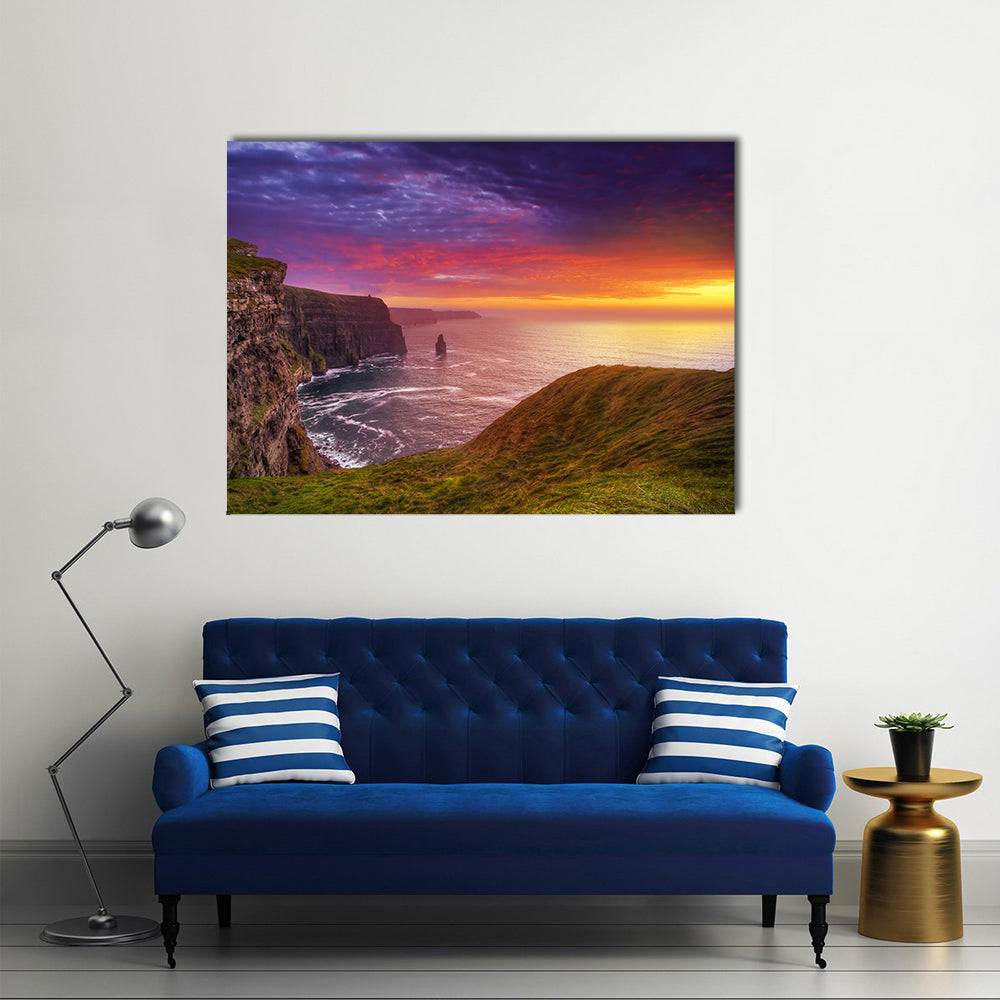 Sunset at the Cliffs of Moher Canvas Wall Art in orange, green and purple, single panel hung on a wall