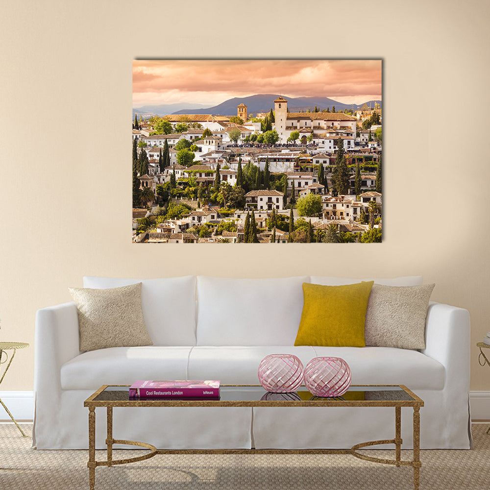 Sunset Over Granada Canvas Wall Art in beige, orange and green, single panel hung on a wall