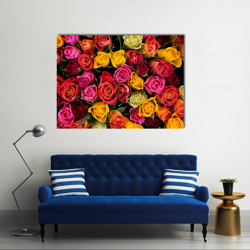 Colorful Roses Bouquet Canvas Wall Art in red, yellow and pink, single panel hung on a wall