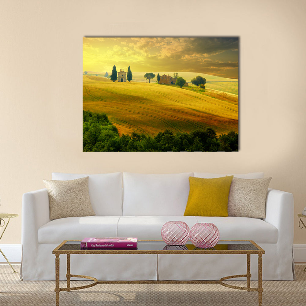 Tuscany at Sunset Canvas Wall Art in gold, yellow and green, single panel hung on a wall