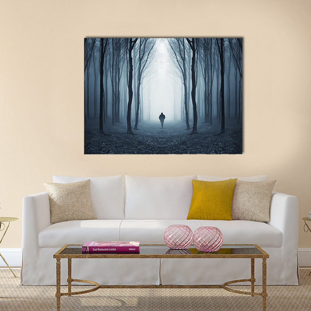 Man Walking Through A Fairytale Forest Canvas Wall Art in black, white and blue, single panel hung on a wall