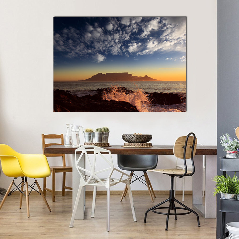 Table Mountain Sunset Over Ocean Canvas Wall Art in brown, orange and blue, single panel hung on a wall