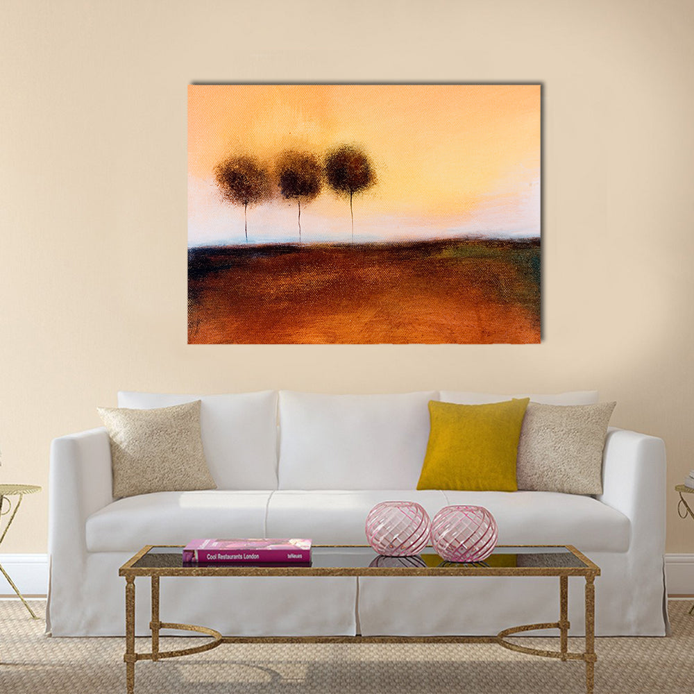 Abstract Three Trees in Autumn Field Canvas Wall Art in brown, orange and yellow, single panel hung on a wall