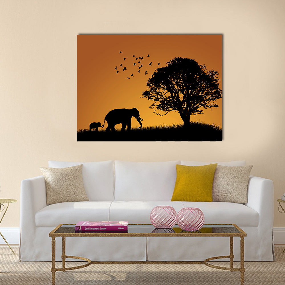 Mother Elephant and Calf at Sunset Canvas Wall Art in black and orange, single panel hung on a wall