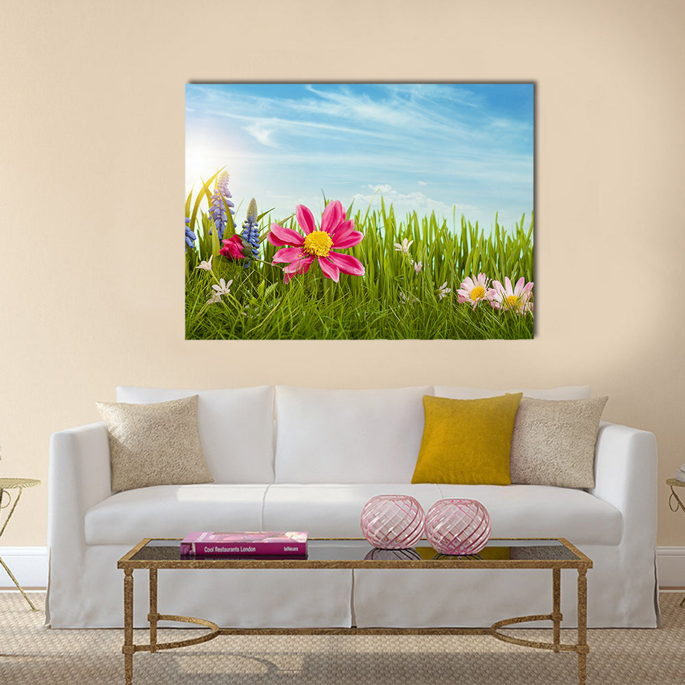 Spring Flowers Under Blue Sky Canvas Wall Art in green, blue and pink, single panel hung on a wall