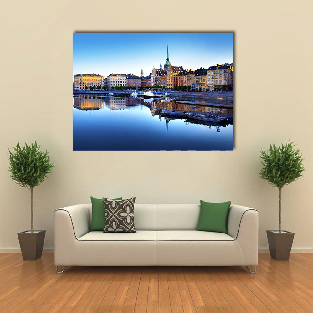 Old Town Of Stockholm In Sweden Canvas Wall Art in orange, yellow and blue, single panel hung on a wall