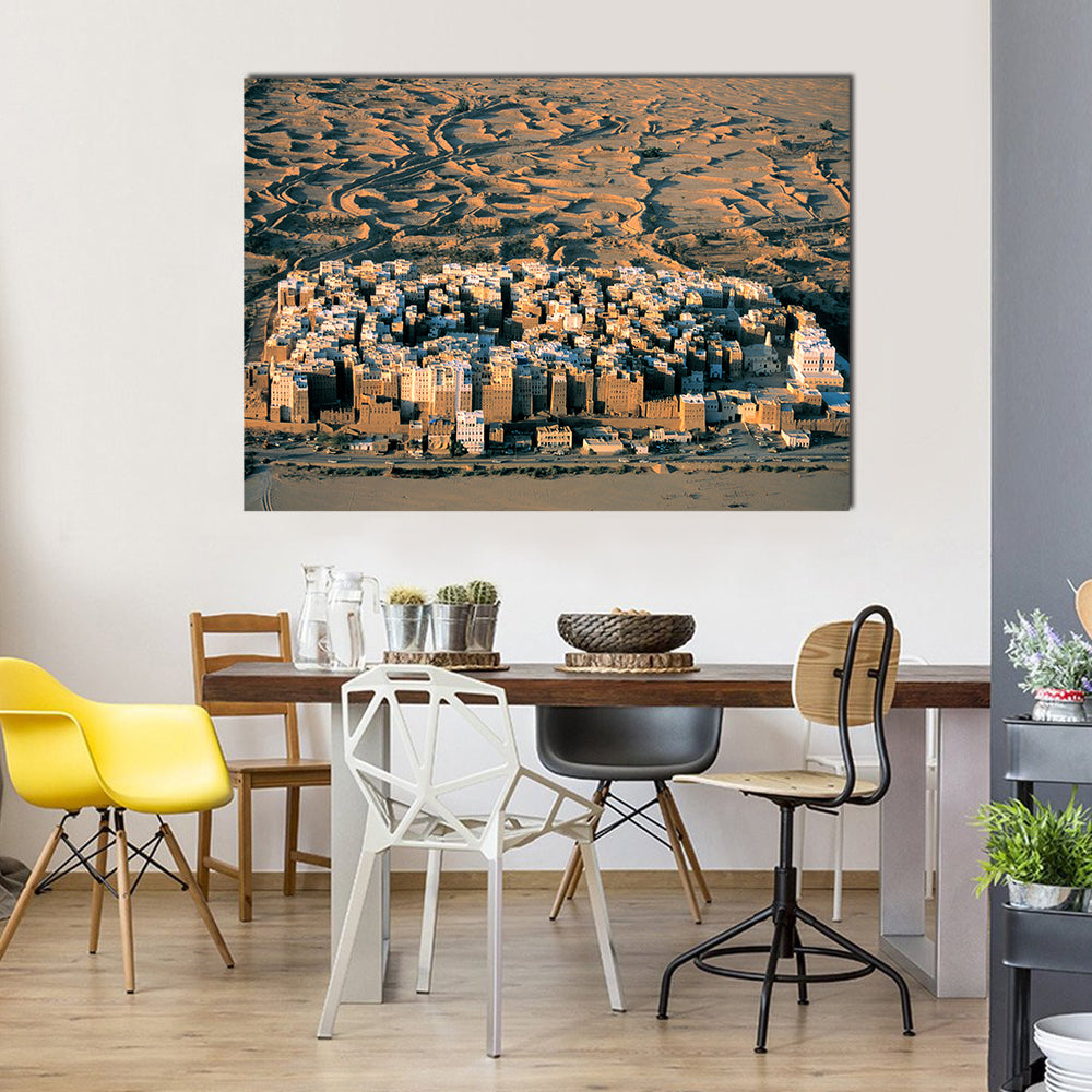 Desert Settlement at Golden Hour Canvas Wall Art in beige, brown and orange, single panel hung on a wall