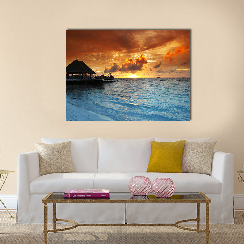 Maldives Thatched Hut on Pier at Sunset Canvas Wall Art