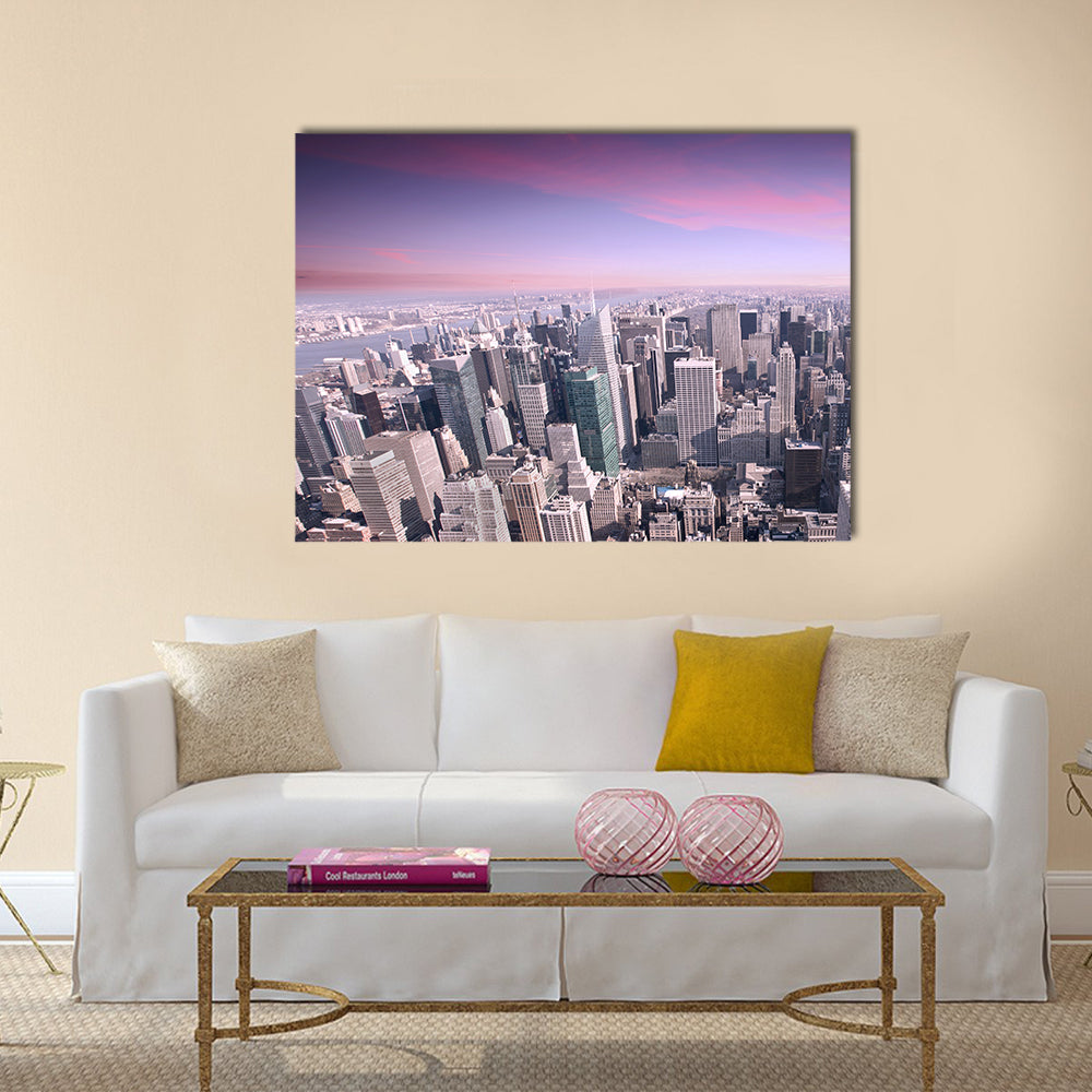 New York City Skyline at Sunset Canvas Wall Art in gray, purple and pink, single panel hung on a wall
