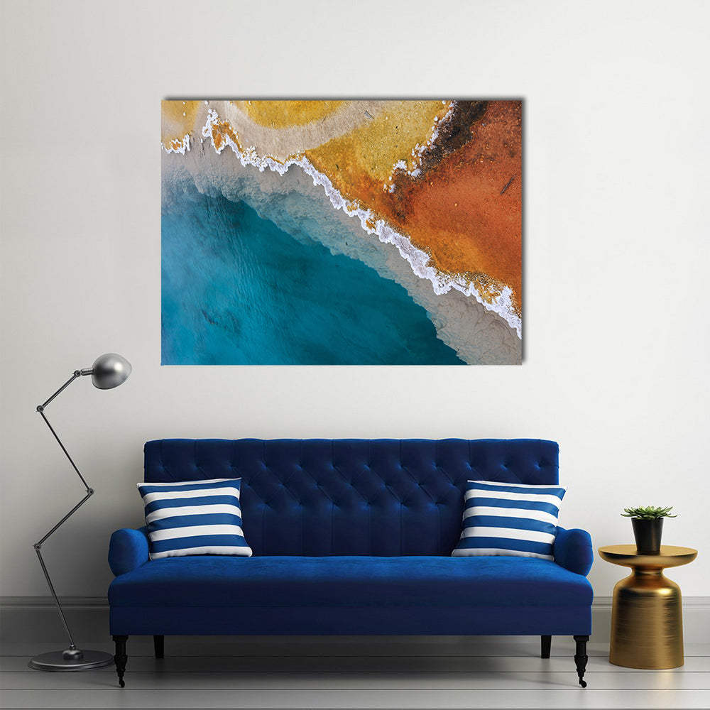 Hot Spring In Yellowstone National Park In Wyoming Canvas Wall Art in orange, yellow and blue, single panel hung on a wall