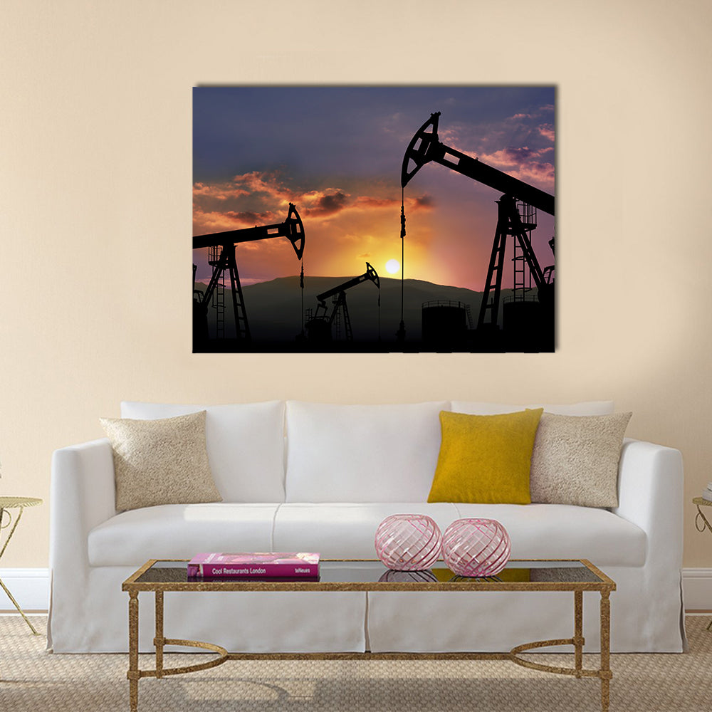 Oil Pumpjacks at Sunset Canvas Wall Art in black, orange and purple, single panel hung on a wall