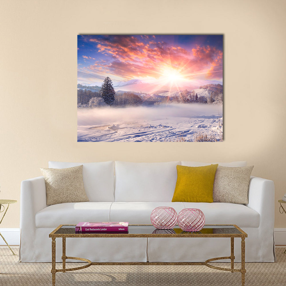 Winter Sunrise Over Snowy Mountains Canvas Wall Art in white, orange and pink, single panel hung on a wall