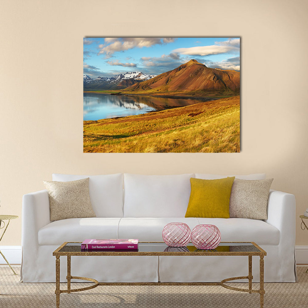 Iceland Mountains and Lake Reflection Canvas Wall Art in brown, yellow and blue, single panel hung on a wall