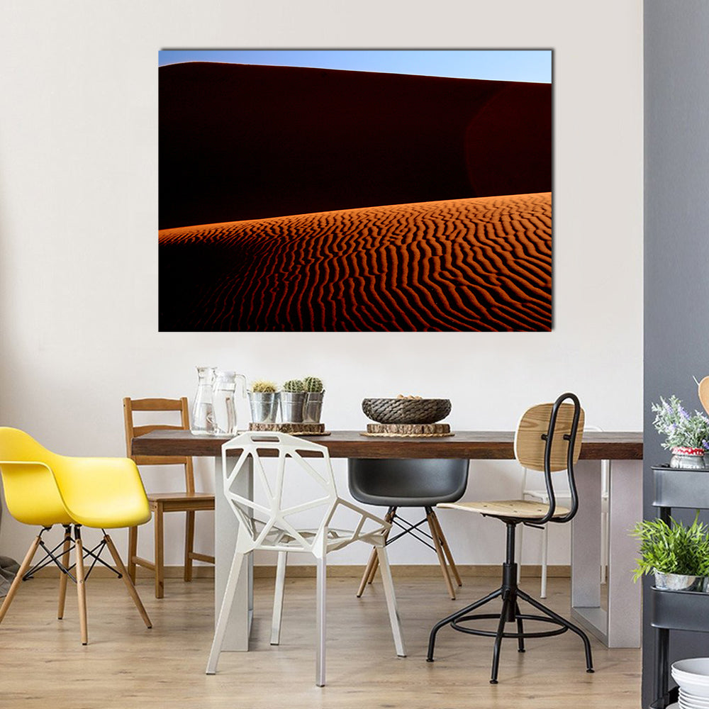 Desert Lines at Sunset Canvas Wall Art in black, orange and blue, single panel hung on a wall
