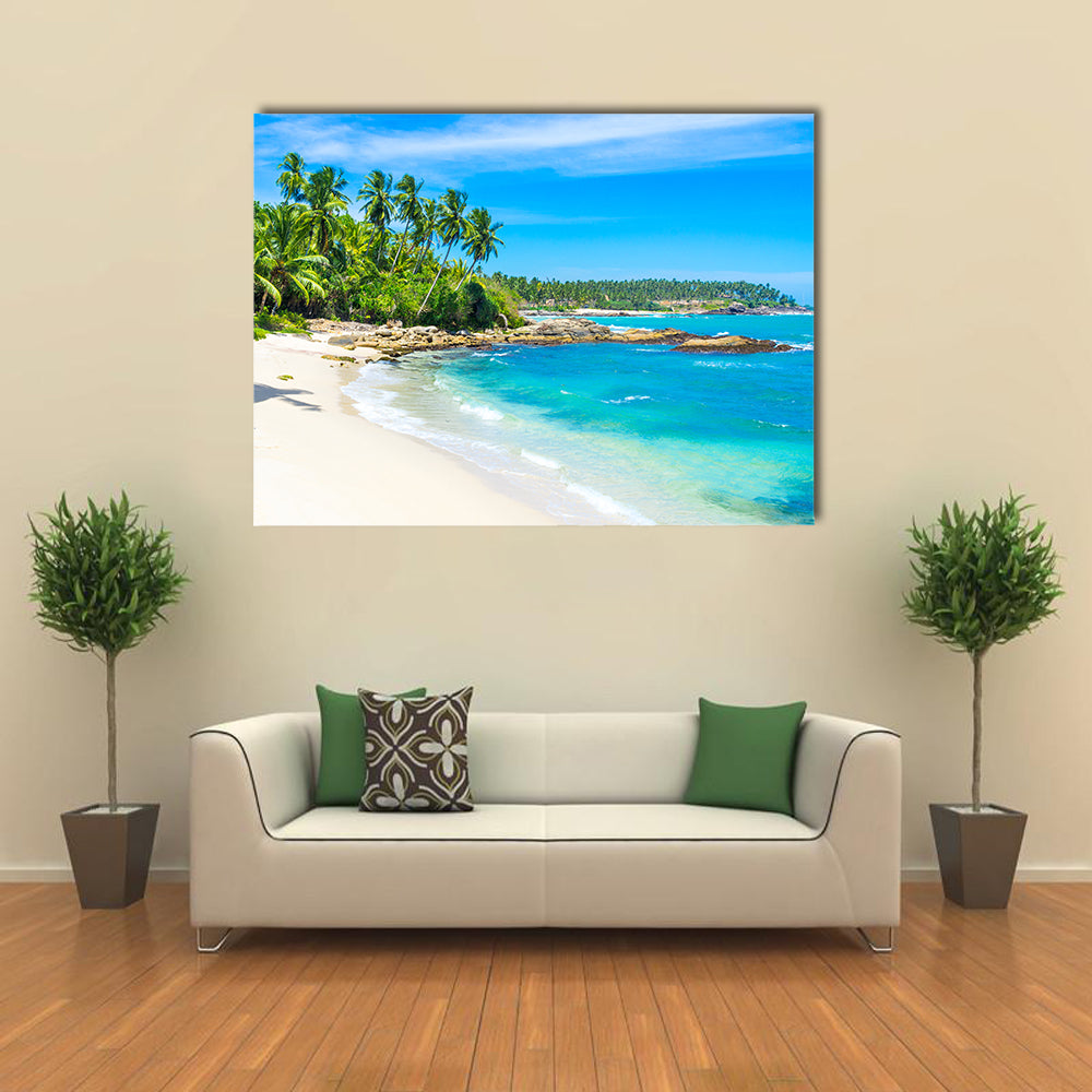 Tropical Beach In Sri Lanka Canvas Wall Art in white, green and blue, single panel hung on a wall