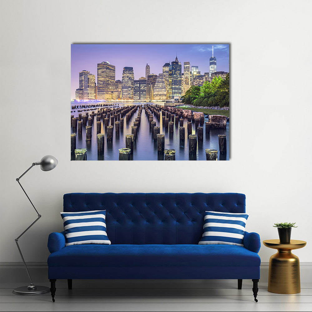 New York City Skyline At Night Canvas Wall Art in yellow, blue and purple, single panel hung on a wall