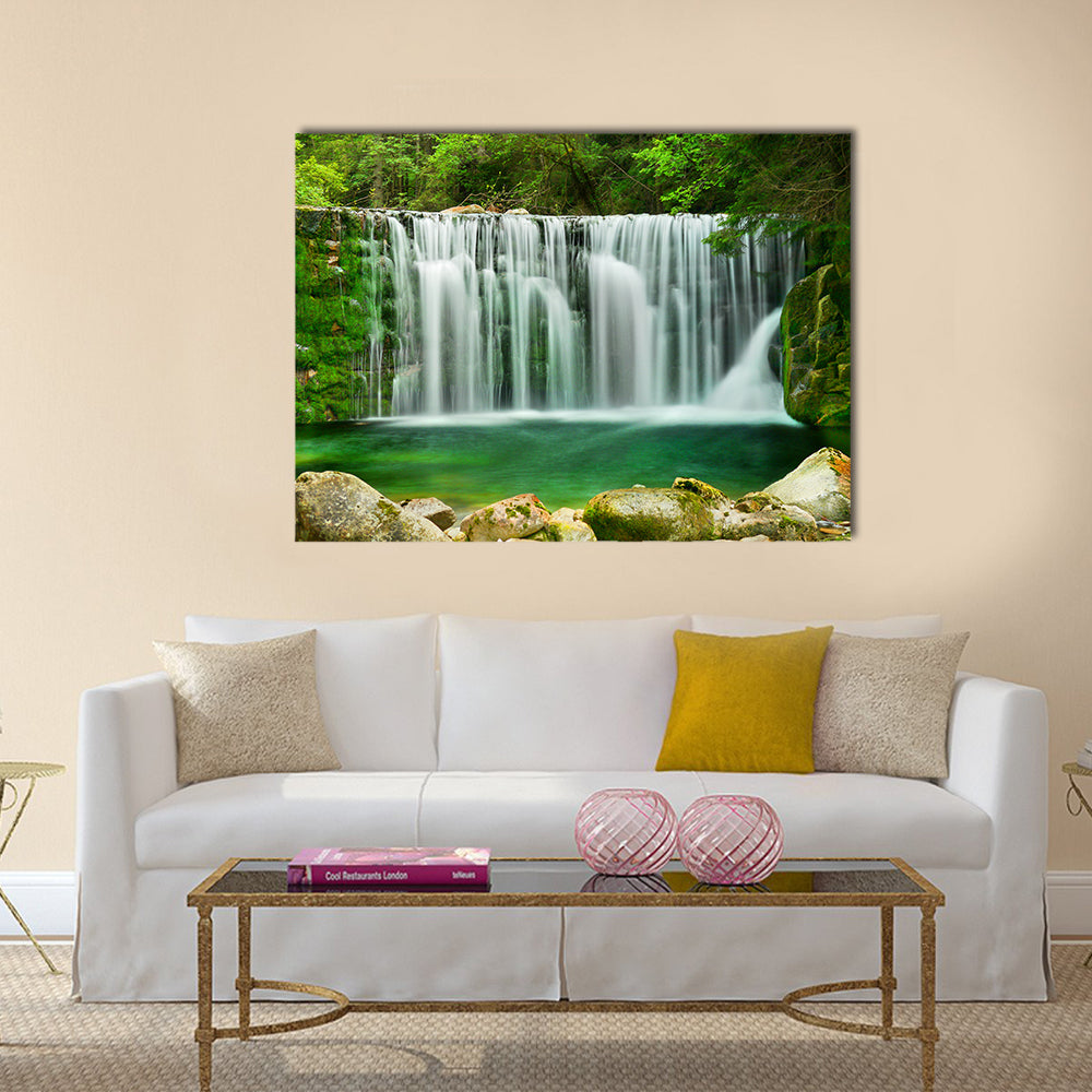 Lake Emerald Waterfalls Canvas Wall Art in white and green, single panel hung on a wall