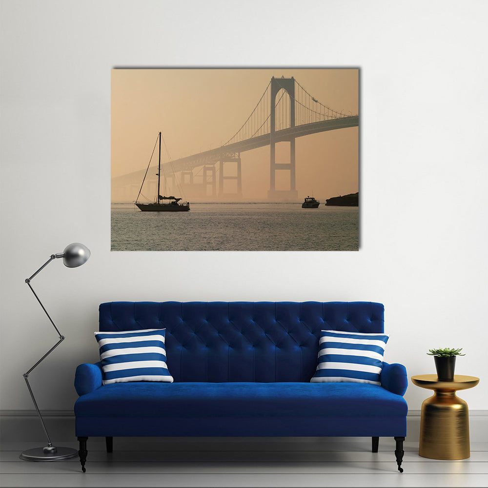 Hazy Suspension Bridge with Sailboat Canvas Wall Art in gray, beige and brown, single panel hung on a wall