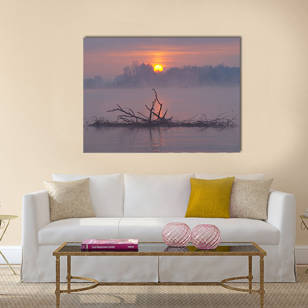 Misty Lake Sunrise Canvas Wall Art in gray, orange and purple, single panel hung on a wall