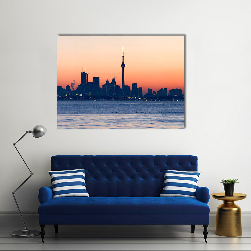 Toronto Skyline At Dawn Canvas Wall Art in orange, blue and pink, single panel hung on a wall