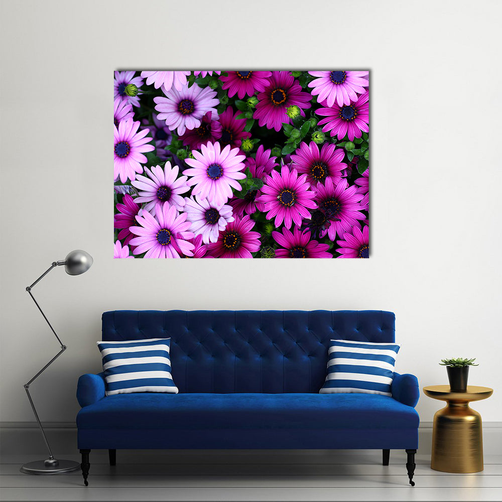 Flowers In The Garden Canvas Wall Art in green, purple and pink, single panel hung on a wall