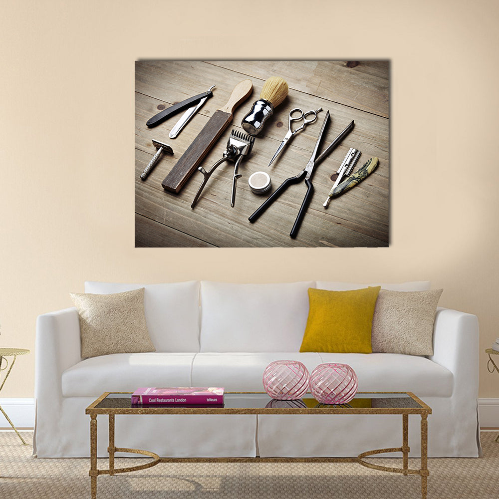 Vintage Barber Tools Flat Lay Canvas Wall Art in beige, brown and silver, single panel hung on a wall