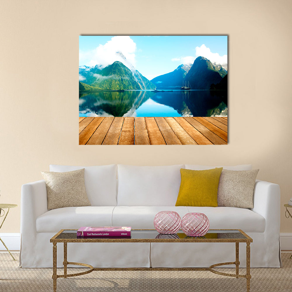 Wooden Pier and Mountain Lake Canvas Wall Art in white, brown and blue, single panel hung on a wall