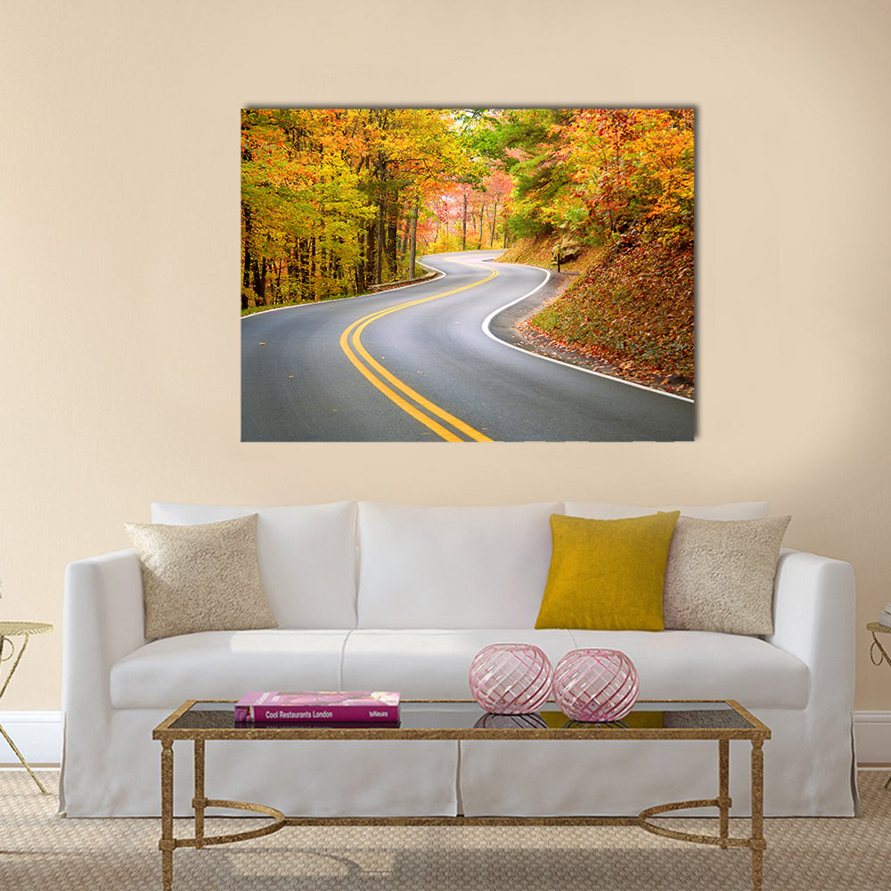 Winding Road Through Fall Forest In Appalachian Mountains Canvas Wall Art in gray, orange and yellow, single panel hung on a wall