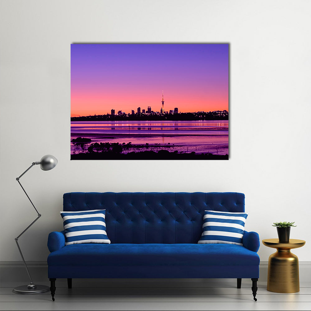 Auckland City Sunrise Canvas Wall Art in orange, purple and pink, single panel hung on a wall