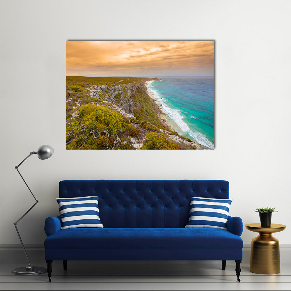 Kangaroo Island Cliffs and Turquoise Sea at Sunset Canvas Wall Art in orange, green and blue, single panel hung on a wall