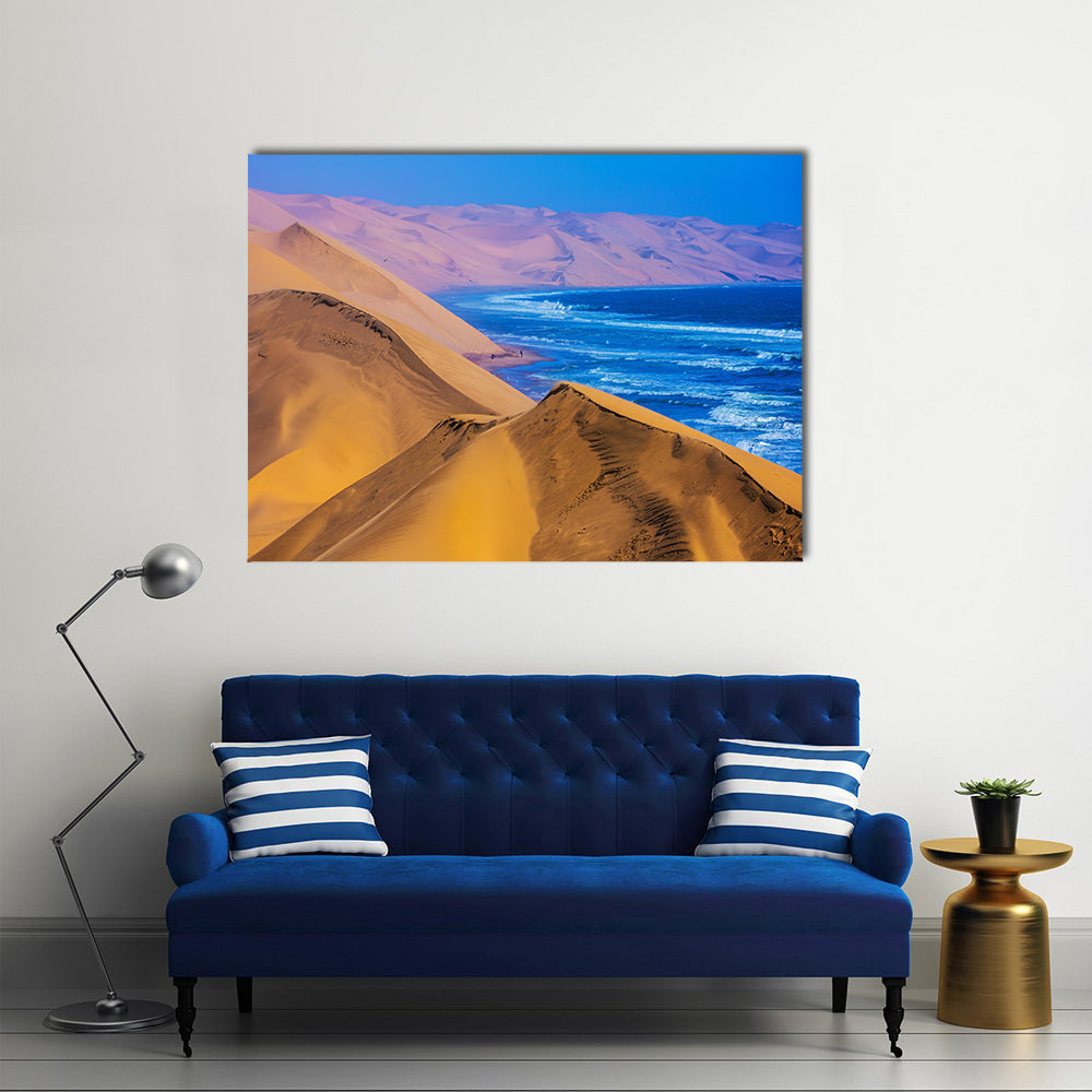 Namibia Sand Dunes Along the Atlantic Coast Canvas Wall Art in beige, orange and blue, single panel hung on a wall