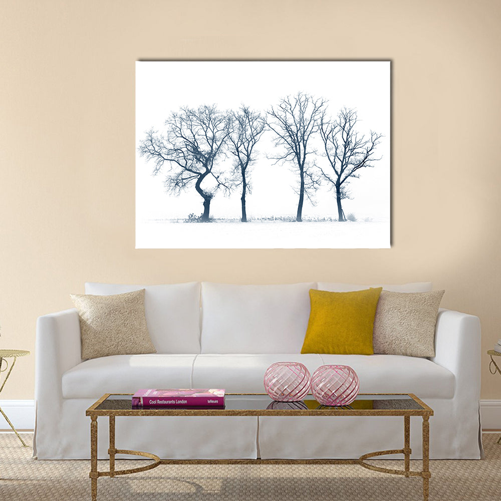 Four Bare Trees in Winter Canvas Wall Art in black, white and blue, single panel hung on a wall