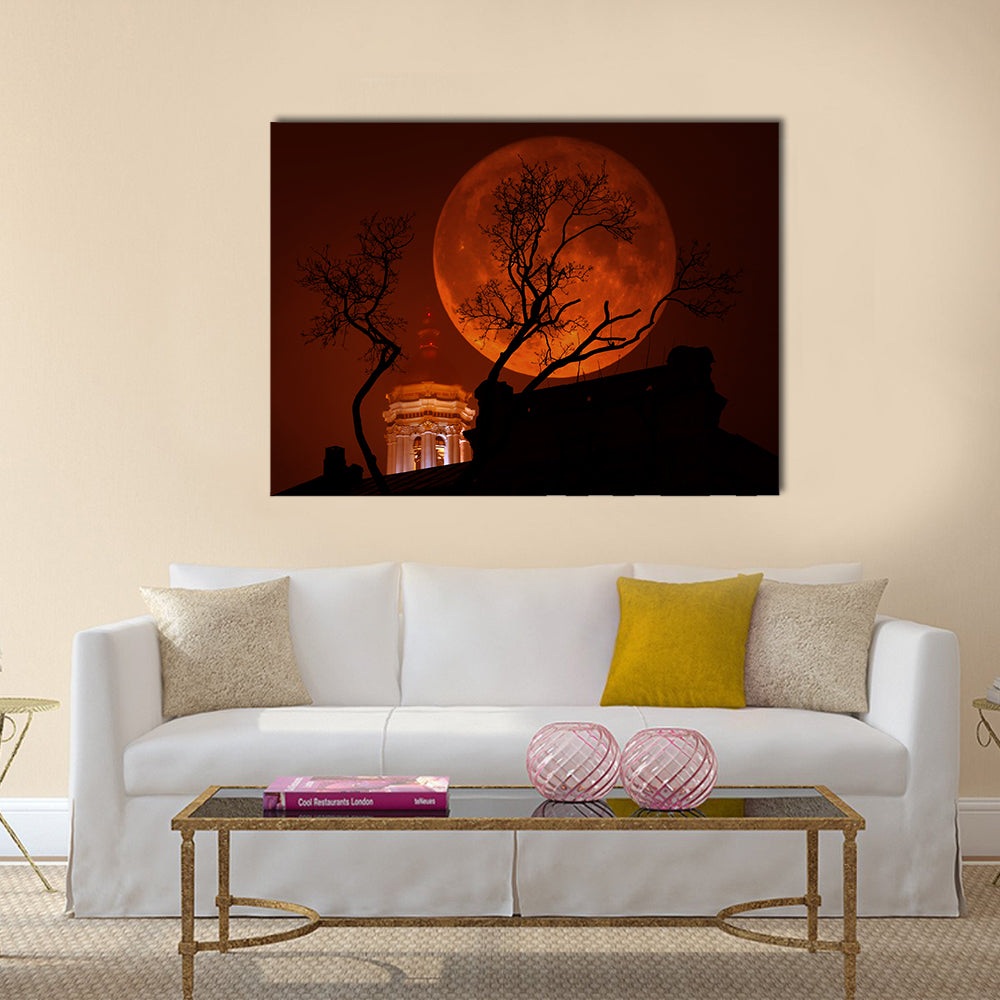 Blood Red Supermoon Over Illuminated Dome Canvas Wall Art in black, red and orange, single panel hung on a wall