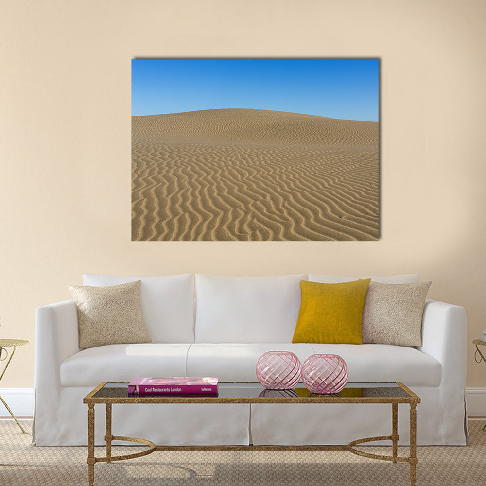Sand Ripples on Desert Dunes Canvas Wall Art in beige, brown and blue, single panel hung on a wall