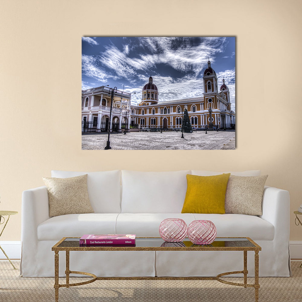 Cathedral of Granada In Nicaragua Canvas Wall Art in white, yellow and blue, single panel hung on a wall