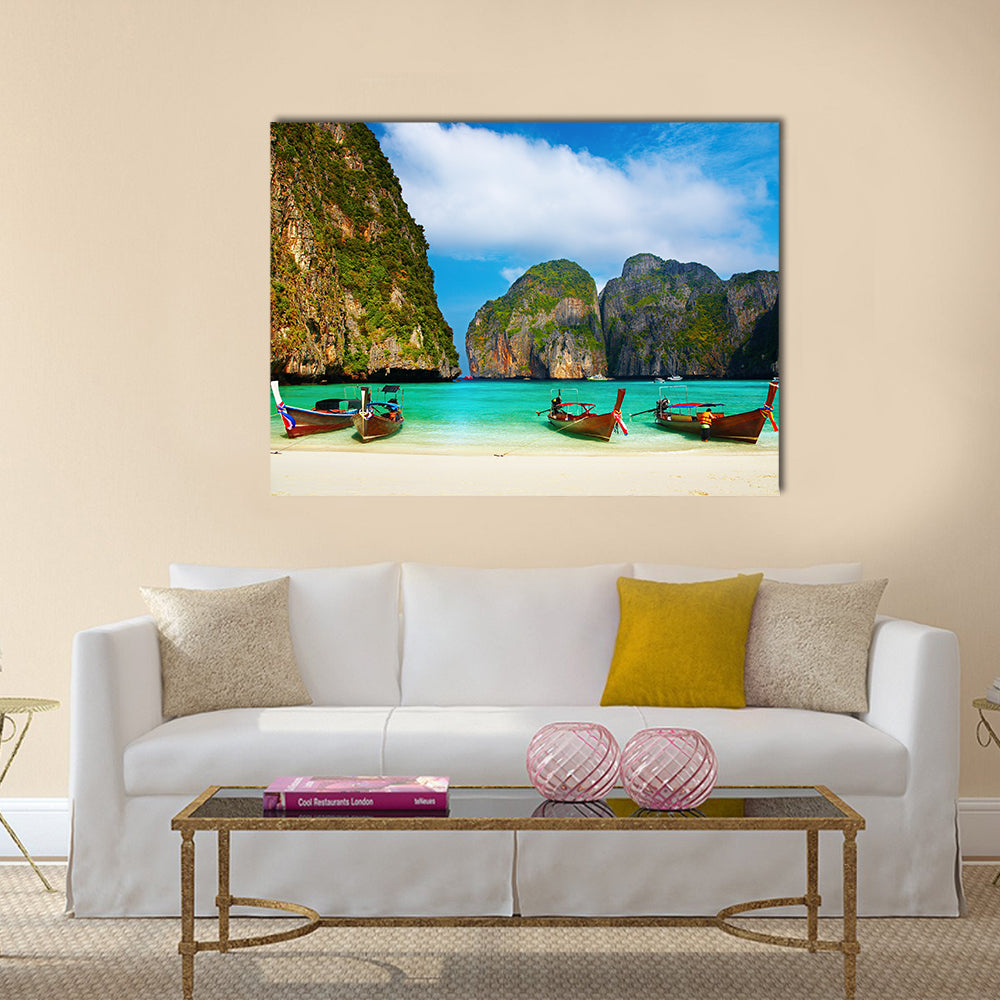 Tropical Beach And Traditional Long Tail Boats In Maya Bay Canvas Wall Art in brown, green and blue, single panel hung on a wall